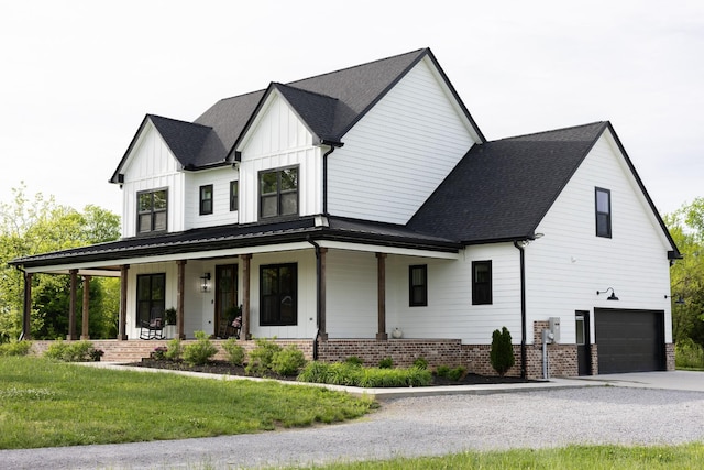 1325 Rogers Ln, Lebanon, TN 37087 - modern inspired farmhouse with a porch, a garage, board and batten siding, a front yard, and driveway