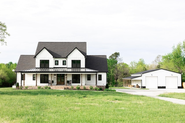 1325 Rogers Ln, Lebanon, TN 37087 - modern farmhouse with a standing seam roof, a front yard, covered porch, an outbuilding, and metal roof
