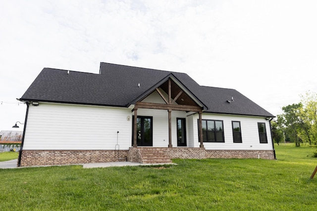 1325 Rogers Ln, Lebanon, TN 37087 - rear view of house featuring a lawn and brick siding