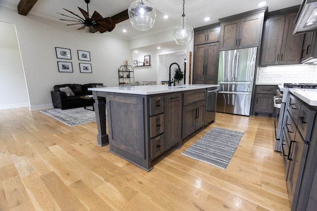 1325 Rogers Ln, Lebanon, TN 37087 - kitchen featuring stainless steel appliances, a sink, dark brown cabinets, light countertops, and recessed lighting