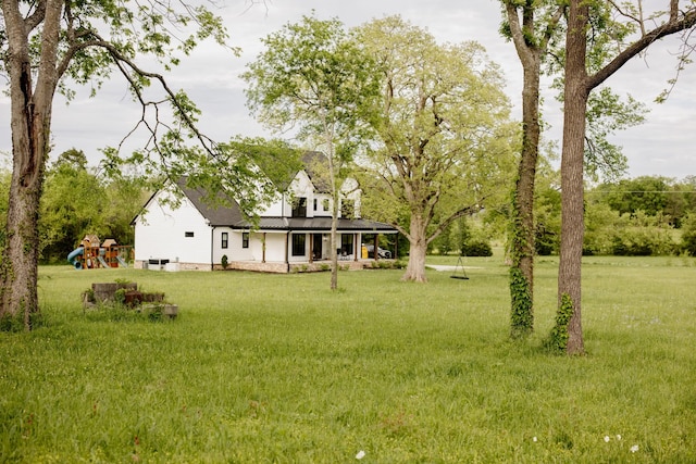 1325 Rogers Ln, Lebanon, TN 37087 - view of grassy yard featuring a playground