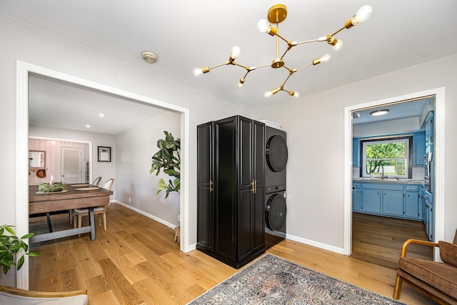 112 Churchill Pl, Franklin, TN 37067 - foyer with stacked washer and clothes dryer, light wood-style floors, a chandelier, baseboards, and recessed lighting