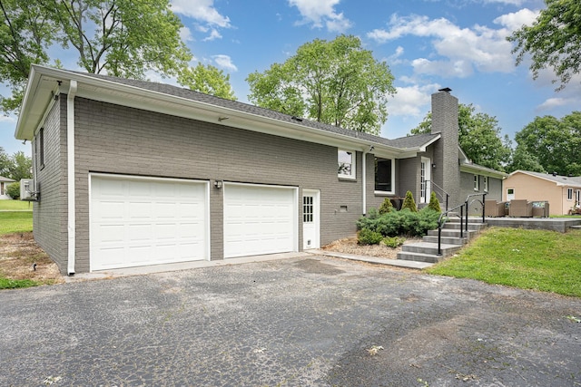 112 Churchill Pl, Franklin, TN 37067 - single story home with driveway, a chimney, a garage, brick siding, and a shingled roof