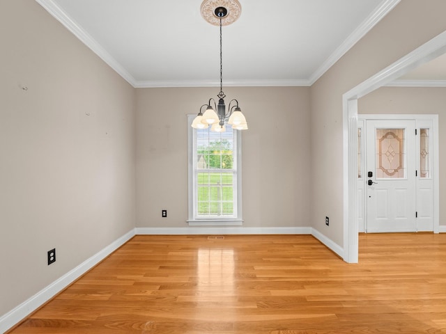 416 Overlook Cir, Tullahoma, TN 37388 - spare room featuring a chandelier, light wood finished floors, crown molding, and baseboards