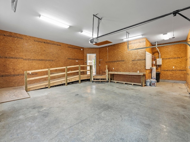 416 Overlook Cir, Tullahoma, TN 37388 - garage featuring a garage door opener and a workshop area