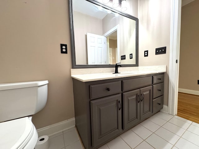 416 Overlook Cir, Tullahoma, TN 37388 - half bathroom featuring toilet, tile patterned floors, vanity, and baseboards