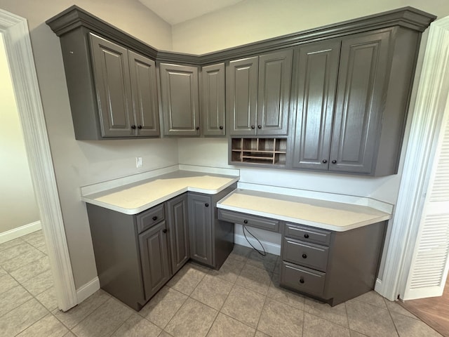 416 Overlook Cir, Tullahoma, TN 37388 - unfurnished office with built in desk, baseboards, and light tile patterned floors