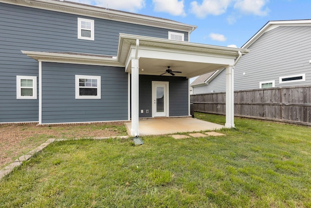 back of property featuring a ceiling fan and a patio area