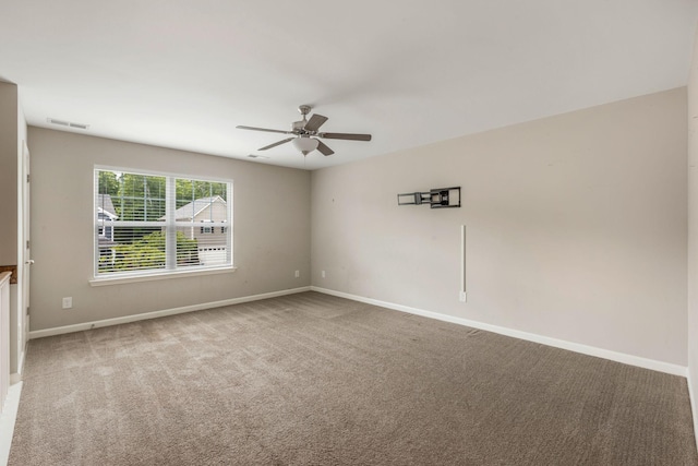 unfurnished room featuring ceiling fan, carpet flooring, and baseboards