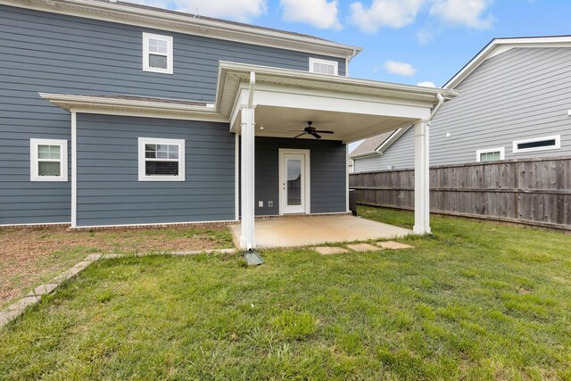 back of property featuring a ceiling fan and a patio area