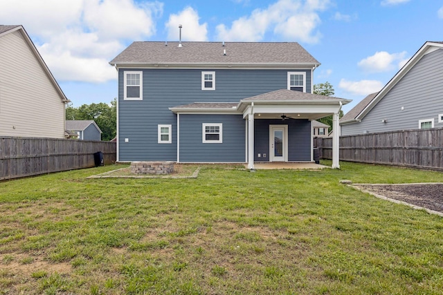 back of property featuring a patio area, a ceiling fan, a fire pit, and roof with shingles