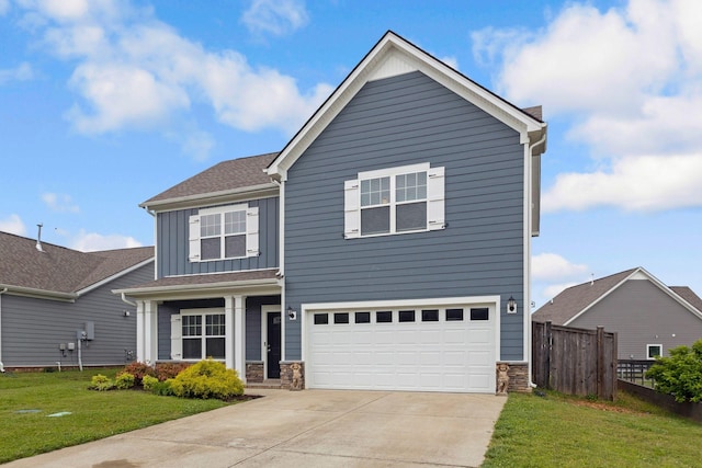 view of front of house featuring board and batten siding, concrete driveway, stone siding, and an attached garage