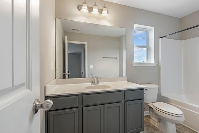 bathroom with toilet, vanity, and tub / shower combination