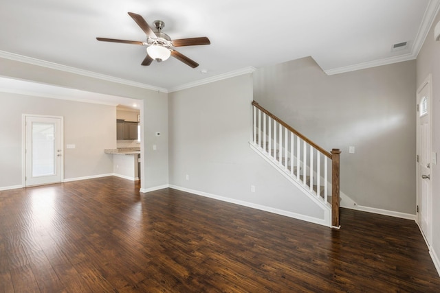 unfurnished living room with stairway, a ceiling fan, dark wood-style floors, crown molding, and baseboards