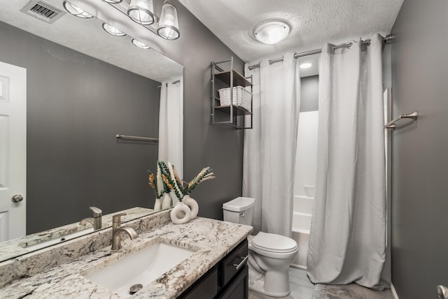 bathroom with a textured ceiling, toilet, vanity, and shower / bathtub combination with curtain