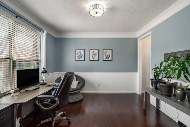 office space with a textured ceiling, hardwood / wood-style flooring, ornamental molding, and baseboards