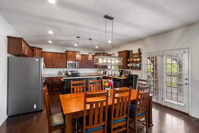 dining area featuring dark wood-style floors, recessed lighting, baseboards, and a textured ceiling