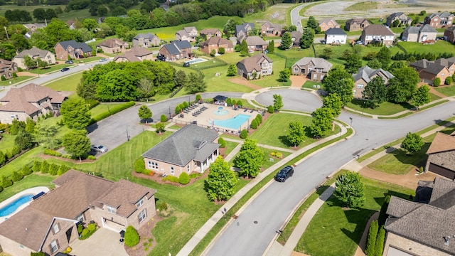 aerial view of residential area featuring a pool area