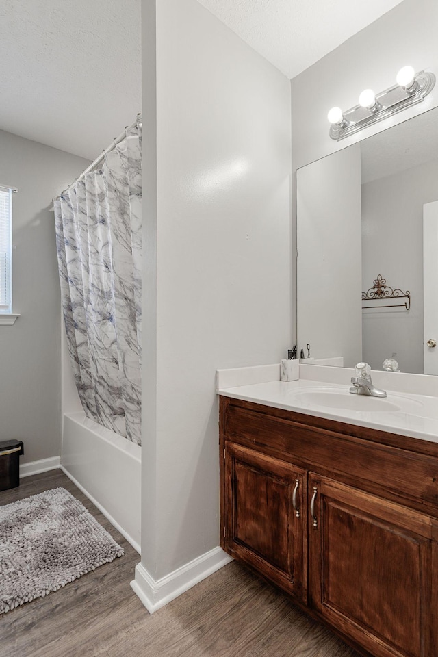 158 Cornerstone Blvd, Portland, TN 37148 - full bath with wood finished floors, vanity, shower / bath combination with curtain, and baseboards