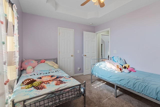 158 Cornerstone Blvd, Portland, TN 37148 - carpeted bedroom featuring a tray ceiling, a ceiling fan, and baseboards