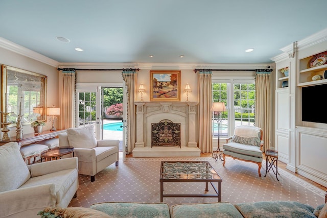 living area featuring crown molding, a premium fireplace, and recessed lighting