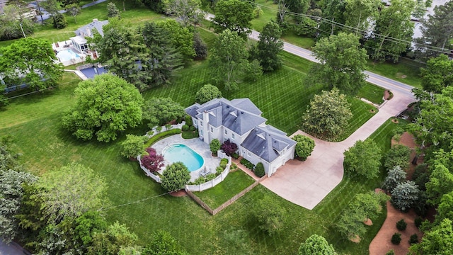 view of subject property with a pool