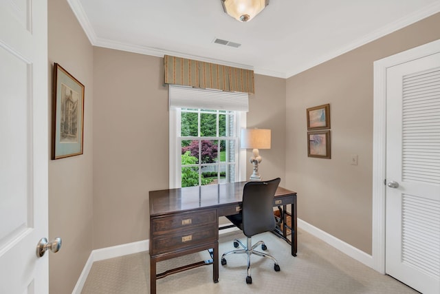 office space featuring baseboards, ornamental molding, and light colored carpet