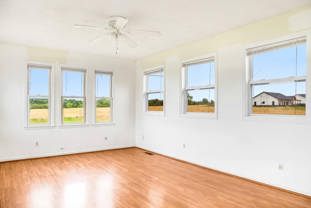 4170 Dot Rd, Springfield, TN 37172 - unfurnished room with light wood-style flooring, ceiling fan, and baseboards