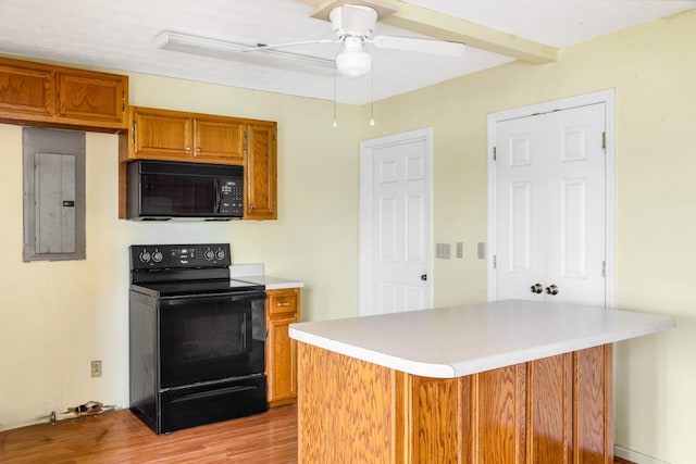 4170 Dot Rd, Springfield, TN 37172 - kitchen featuring black appliances, electric panel, light countertops, ceiling fan, and brown cabinetry