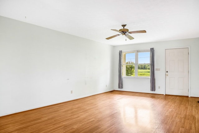 4170 Dot Rd, Springfield, TN 37172 - spare room featuring light wood-type flooring, a ceiling fan, and baseboards