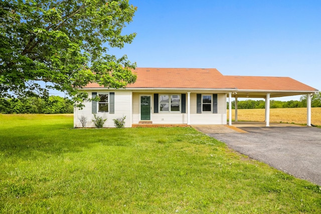 4170 Dot Rd, Springfield, TN 37172 - single story home with driveway, an attached carport, and a front yard