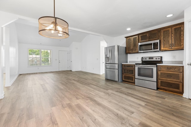 kitchen with stainless steel appliances, light wood-style flooring, a chandelier, light countertops, and recessed lighting