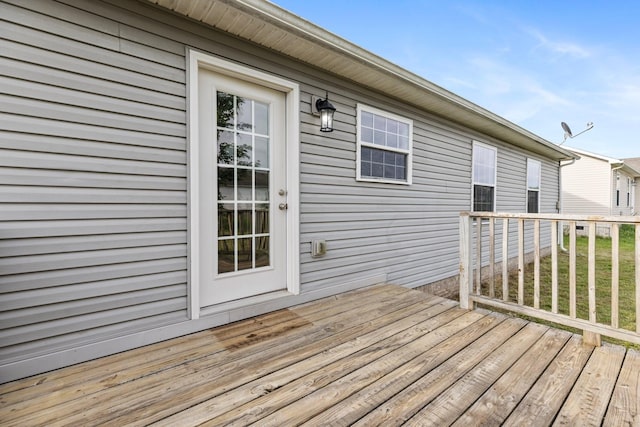 wooden terrace with a yard