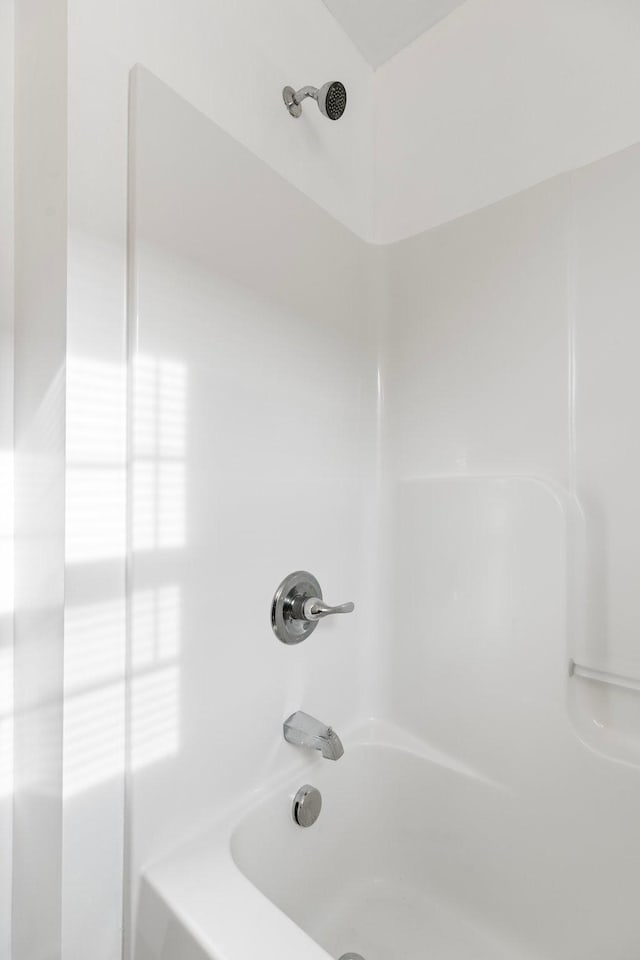 full bathroom featuring  shower combination