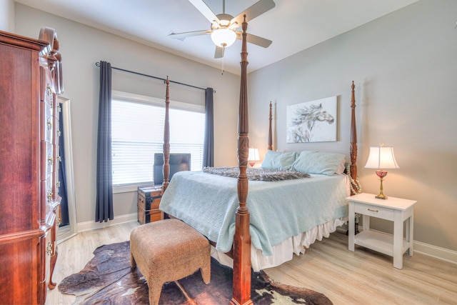 bedroom with baseboards, light wood-style floors, and ceiling fan
