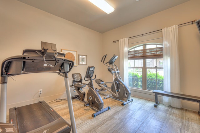 exercise room with baseboards