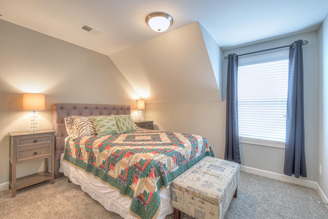 bedroom with carpet, multiple windows, and baseboards