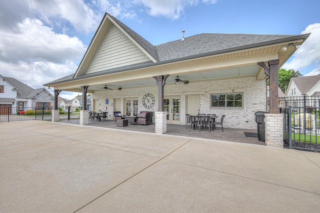 back of property with french doors, fence, ceiling fan, brick siding, and roof with shingles