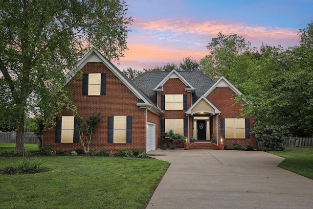 219 Oscar Ct, Murfreesboro, TN 37128 - traditional-style house with driveway, brick siding, and an attached garage