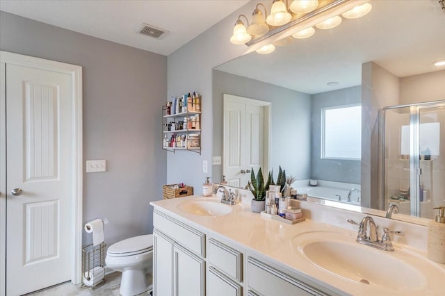 full bathroom with toilet, a shower stall, double vanity, and a bath