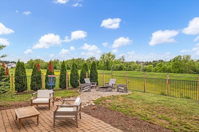 view of patio / terrace featuring an outdoor fire pit