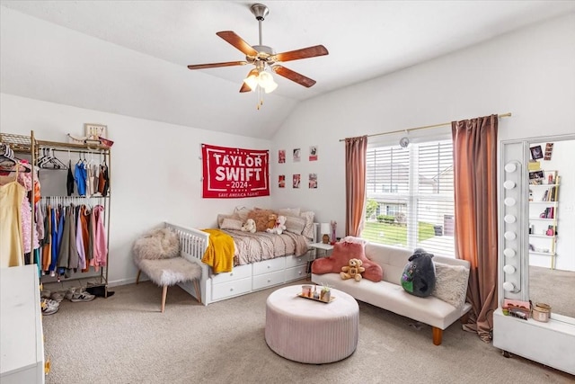 bedroom featuring carpet flooring, vaulted ceiling, and ceiling fan
