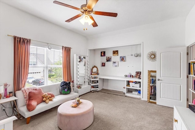 sitting room with light carpet and ceiling fan