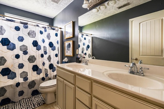 full bath featuring toilet, double vanity, a textured ceiling, tile patterned flooring, and a shower with curtain