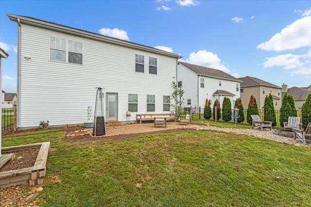rear view of house with an outdoor living space with a fire pit, a patio, and a residential view