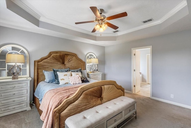 bedroom featuring a raised ceiling, carpet floors, ornamental molding, baseboards, and a ceiling fan