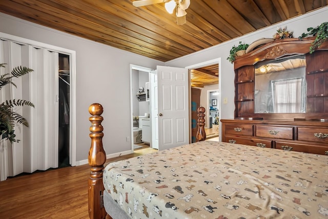 6966 Park Dr, Lyles, TN 37098 - bedroom featuring wood finished floors, wood ceiling, ensuite bath, baseboards, and a closet