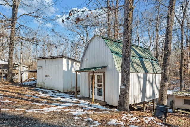 6966 Park Dr, Lyles, TN 37098 - snow covered structure with french doors, an outdoor structure, and a storage shed