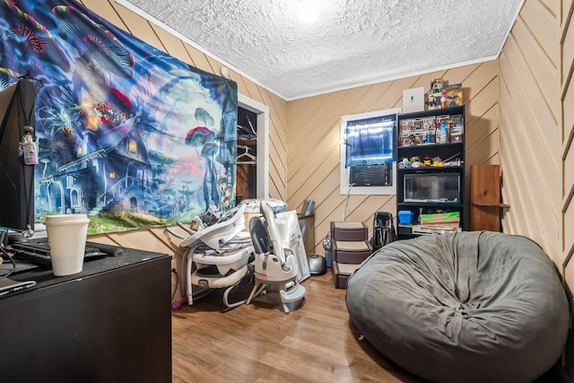 6966 Park Dr, Lyles, TN 37098 - sitting room featuring wood finished floors, a textured ceiling, and cooling unit