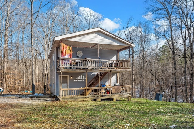 6966 Park Dr, Lyles, TN 37098 - rustic home with a wooden deck, a front lawn, and stairs
